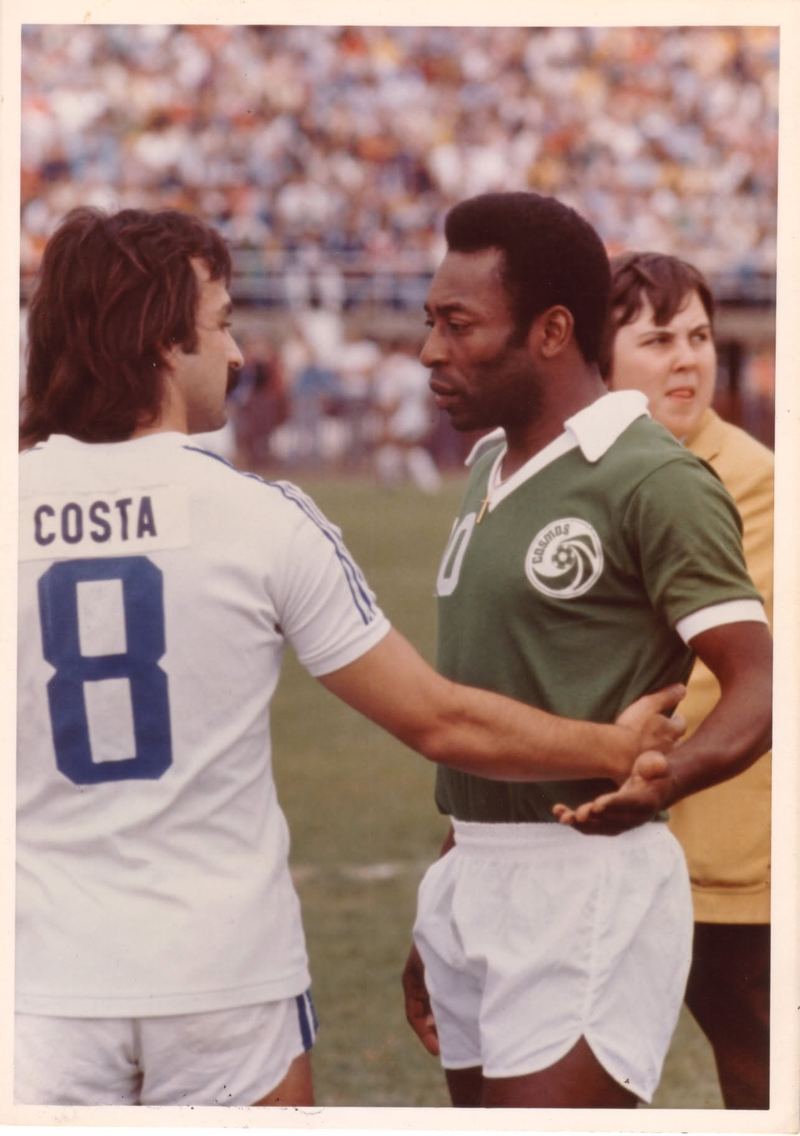 1977: José Costa, in a white Rochester Lancers shirt with “Costa 8” on the back, greets Pelé, who wears the green Cosmos shirt