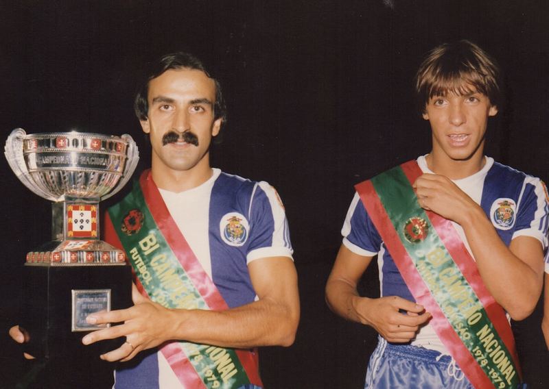 José Costa holding the Campeonato Nacional trophy, wearing a “Bi Campeão Nacional 1978-1979” sash, next to a teammate; both in the FC Porto kit