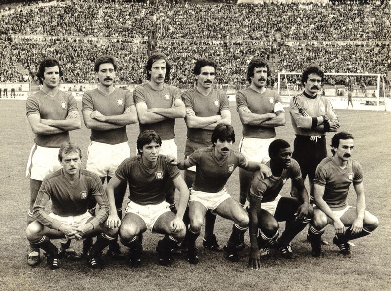 Black and white photo of the Portugal team lined up in front of a packed stand