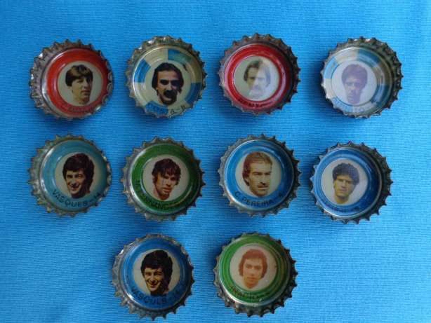 Ten Schweppes bottle caps with small player portraits, on a blue background